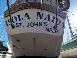 Isola Naida's Transom with old vinyl decals, 2026